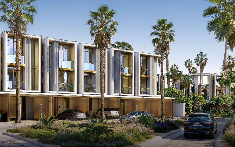 Tilal Binghatti — daytime view of villa façades framed by mature palms and private driveways